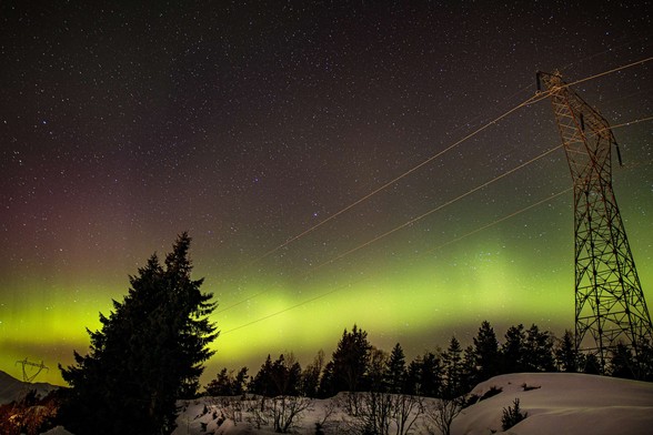 photo - Northern Lights over high voltage powerlines