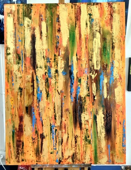 a painting, it is streaks of gold paint , orange and some blue and dark red, coming down vertically