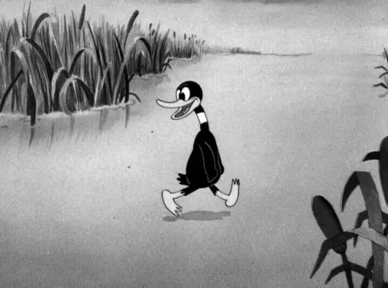 A black and white still of the duck (later known as Daffy) in 'Porky's Duck Hunt, a cartoon released in 1937.